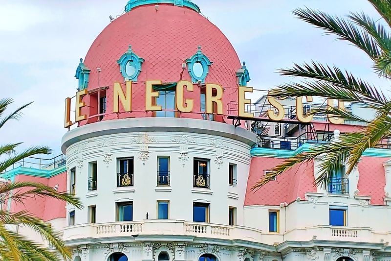 The white façade and pink dome of Le Negresco on the Promenade des Anglais