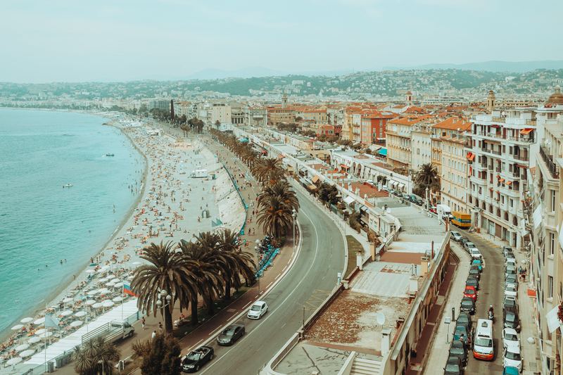 Looking down on the Promenade des Anglais, its palm trees and the beach